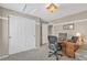 Bedroom with a work desk and a large closet at 10877 W 55Th Ln, Arvada, CO 80002