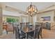 Elegant dining room with modern chandelier and ample seating for gatherings at 10877 W 55Th Ln, Arvada, CO 80002