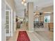 Open foyer with tile flooring and views of living and dining spaces at 10877 W 55Th Ln, Arvada, CO 80002