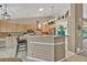 Well-lit kitchen with breakfast bar and modern appliances at 10877 W 55Th Ln, Arvada, CO 80002