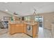 Kitchen with stainless steel appliances, tile countertops, and open floor plan at 10877 W 55Th Ln, Arvada, CO 80002