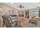 Cozy living room with fireplace and vaulted ceilings, ideal for relaxation at 10877 W 55Th Ln, Arvada, CO 80002