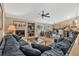 Inviting living room featuring a fireplace and seamless flow to the kitchen at 10877 W 55Th Ln, Arvada, CO 80002