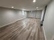 Large finished basement with plank flooring, recessed lighting, and neutral paint is move-in ready at 8307 E 14Th Ave, Denver, CO 80220