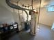 Utility room with water heater and other equipment at 8307 E 14Th Ave, Denver, CO 80220