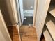 Bathroom featuring dark tile floors, white cabinets, and a shower-tub combo at 8307 E 14Th Ave, Denver, CO 80220