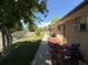 Exterior view of brick home featuring a lush green front yard, sidewalk, and shade tree at 8307 E 14Th Ave, Denver, CO 80220