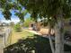 Charming home with a well-maintained front yard, mature trees, and a sidewalk leading to the front door at 8307 E 14Th Ave, Denver, CO 80220