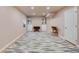 Spacious basement area with a patterned carpet, lighting and storage cabinets at 14791 E Poundstone Dr, Aurora, CO 80015