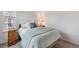 Bedroom featuring a comfortable bed, side table and a window offering natural light at 14791 E Poundstone Dr, Aurora, CO 80015