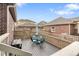 This deck features a dining table with seating for four and views of the surrounding neighborhood at 14791 E Poundstone Dr, Aurora, CO 80015