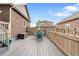 This deck features a dining table with seating for four and views of the surrounding neighborhood at 14791 E Poundstone Dr, Aurora, CO 80015