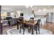 Open-concept dining area connected to the kitchen and living room, creating a welcoming space at 14791 E Poundstone Dr, Aurora, CO 80015