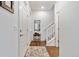 Light and bright entryway with hardwood floors and staircase at 14791 E Poundstone Dr, Aurora, CO 80015