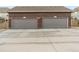 The garage features two bays with gray doors at 14791 E Poundstone Dr, Aurora, CO 80015