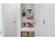 Mudroom with bench seating, storage baskets, and hooks for coats and bags at 14791 E Poundstone Dr, Aurora, CO 80015