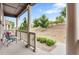 Charming porch with comfortable seating and views of the landscaped yard at 14791 E Poundstone Dr, Aurora, CO 80015