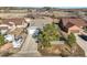 Aerial view of the property showcasing the home's layout, driveway, and surrounding neighborhood at 819 Meadow Ln, Palmer Lake, CO 80133