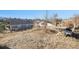 View of backyard with chairs and table on a sunny day, ideal for outdoor relaxation and entertainment at 819 Meadow Ln, Palmer Lake, CO 80133