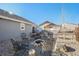 Backyard fire pit area with gravel, seating, perfect for gatherings and outdoor enjoyment at 819 Meadow Ln, Palmer Lake, CO 80133