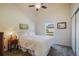 Bedroom features gray carpet, ceiling fan, neutral walls, and a full-sized bed at 819 Meadow Ln, Palmer Lake, CO 80133