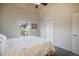 Bedroom features gray carpet, ceiling fan, neutral walls, and a double closet at 819 Meadow Ln, Palmer Lake, CO 80133