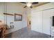 Bright bedroom with a ceiling fan, closet with sliding doors and a wall art at 819 Meadow Ln, Palmer Lake, CO 80133