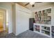 Bright bedroom with a ceiling fan, closet with sliding doors and a white bookshelf filled with books at 819 Meadow Ln, Palmer Lake, CO 80133