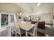 Dining area with an open floor plan that allows for a view of both the kitchen and living room at 819 Meadow Ln, Palmer Lake, CO 80133