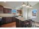 Updated kitchen featuring stainless appliances, marble countertops, island, and wooden cabinets at 819 Meadow Ln, Palmer Lake, CO 80133