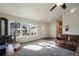 Inviting living room with lots of natural light and comfortable leather sofa at 819 Meadow Ln, Palmer Lake, CO 80133