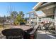 Covered patio featuring comfortable seating, a dining table, and inviting outdoor ambiance at 819 Meadow Ln, Palmer Lake, CO 80133