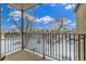 Balcony view with a black metal railing overlooking a snow covered landscape at 2281 S Vaughn Way # 316A, Aurora, CO 80014