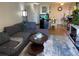 Inviting living room with cozy seating, a decorative rug, and great natural light at 2281 S Vaughn Way # 316A, Aurora, CO 80014