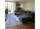Spacious living room with hardwood floors, large windows, and a comfortable sofa at 2281 S Vaughn Way # 316A, Aurora, CO 80014