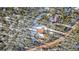 A high-angle view of a log cabin encircled by dense trees in a beautiful woodland setting at 255 Divide View Dr, Golden, CO 80403
