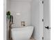 Modern bathroom with white soaking tub, white subway tile and vintage accent tile at 255 Divide View Dr, Golden, CO 80403