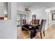 Dining room with wood table, bench, decorative ceiling fan and views of the outdoor scenery at 255 Divide View Dr, Golden, CO 80403
