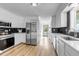Bright kitchen featuring stainless steel appliances, including a double-door refrigerator and modern oven at 255 Divide View Dr, Golden, CO 80403