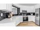 Modern kitchen features quartz countertops and new stainless-steel appliances at 255 Divide View Dr, Golden, CO 80403