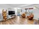 Spacious living room with an entertainment center, stylish decor, and outdoor access at 255 Divide View Dr, Golden, CO 80403
