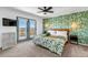 Bright bedroom featuring a balcony with mountain views and green leaf wallpaper at 255 Divide View Dr, Golden, CO 80403