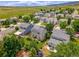 Aerial view of a neighborhood with homes and mountain views at 9595 Elk Mountain Cir, Littleton, CO 80125