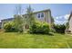 Large backyard with landscaping and a partial view of the house at 9595 Elk Mountain Cir, Littleton, CO 80125