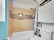 Bathroom featuring tile accents, a bathtub, a shower and toilet at 9595 Elk Mountain Cir, Littleton, CO 80125