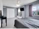 Bedroom features carpet, natural light, and a gray accent wall at 9595 Elk Mountain Cir, Littleton, CO 80125