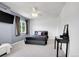 Bedroom features a ceiling fan, dark curtains, carpeted floors and a window at 9595 Elk Mountain Cir, Littleton, CO 80125