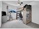 Bedroom includes a lofted bed, a desk, and a cat tower next to the window at 9595 Elk Mountain Cir, Littleton, CO 80125