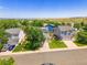 Exterior of a two-story home with a well-kept lawn, driveway, and mature landscaping in a suburban neighborhood at 9595 Elk Mountain Cir, Littleton, CO 80125