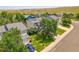 A well-maintained, two-story home with solar panels, a manicured lawn, and mature trees in a suburban neighborhood at 9595 Elk Mountain Cir, Littleton, CO 80125
